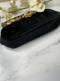 Authentic Chanel velvet/Brass and charms clutch bag